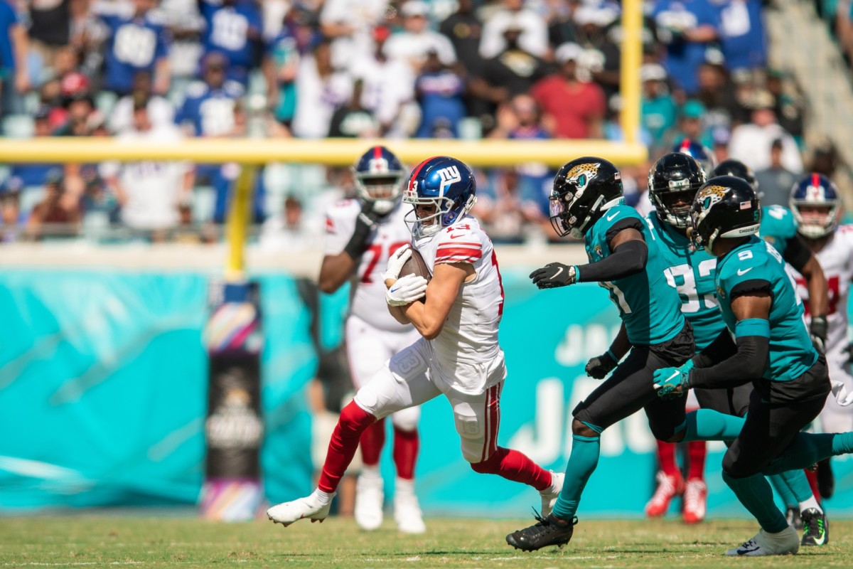 Oct 23, 2022; Jacksonville, Florida, USA; New York Giants wide receiver David Sills V (13) runs the ball against the Jacksonville Jaguars in the second quarter at TIAA Bank Field.